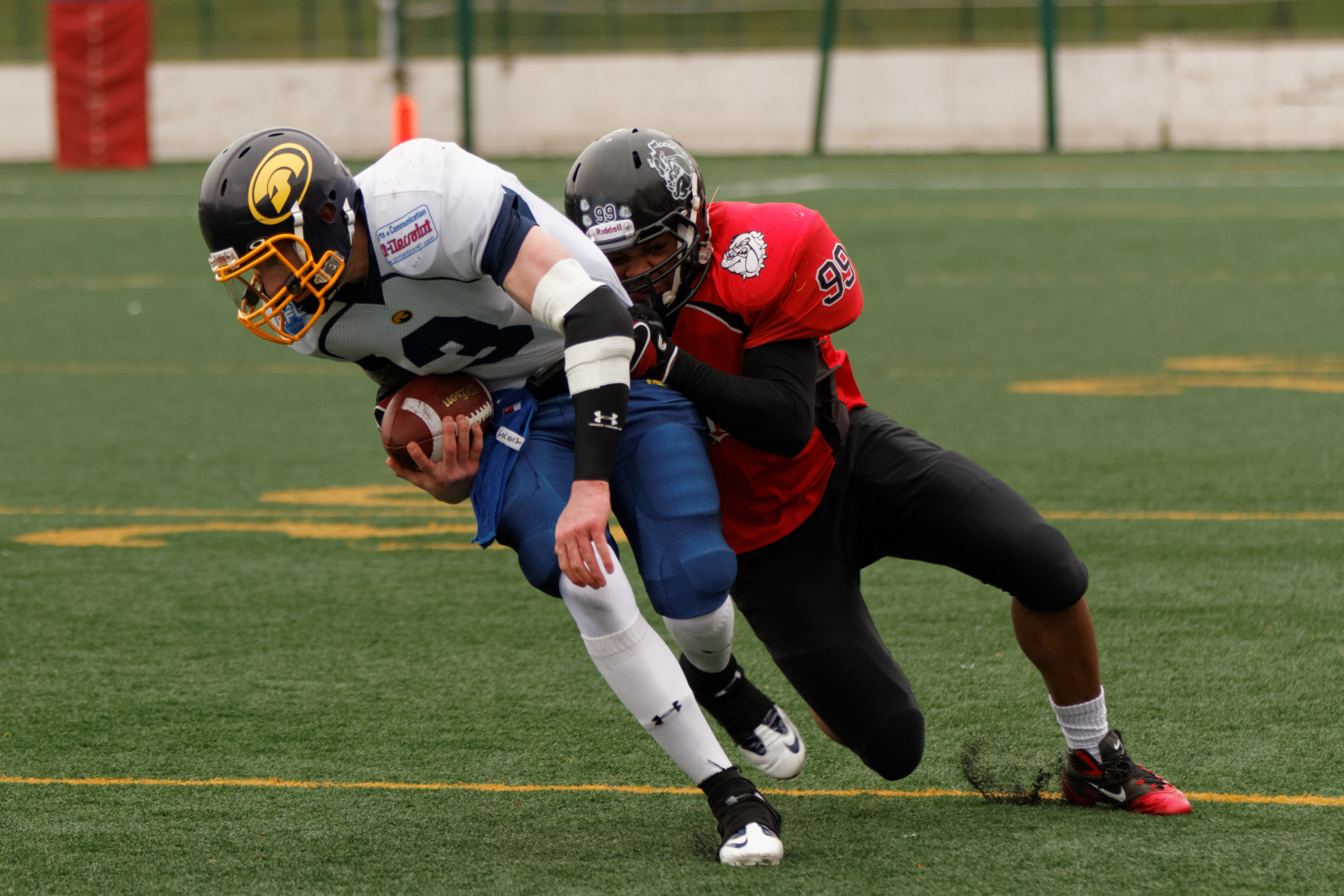 player tackling another player in football